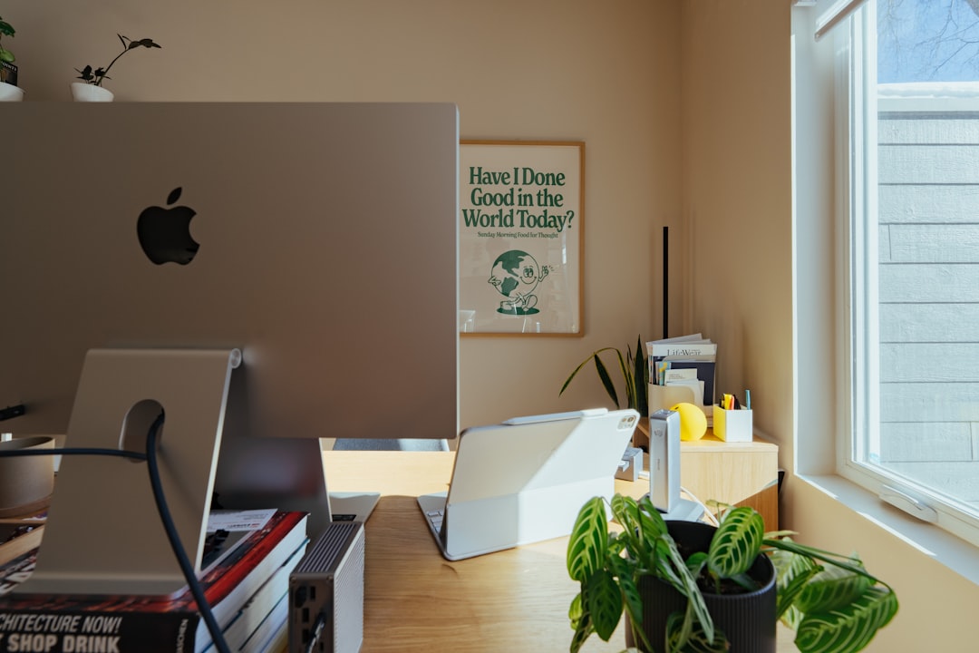 desk-with-apple-monitor-plants-and-window-bpdqef1dd4